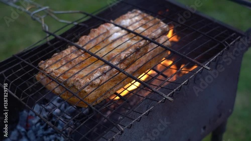 Roasting meat on the grill. Cooking ribs on the grill