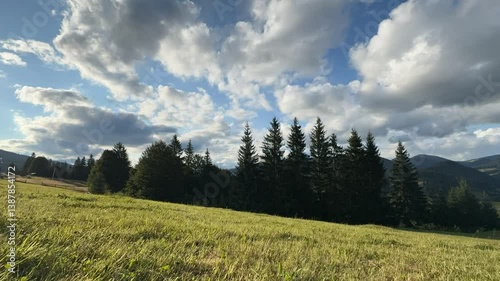 Timelapse of cumulus clouds moves in the blue sky. The background of light and heavy calm clouds changes shape in cloudy space. Natural background, time-lapse, copy space. 4K.