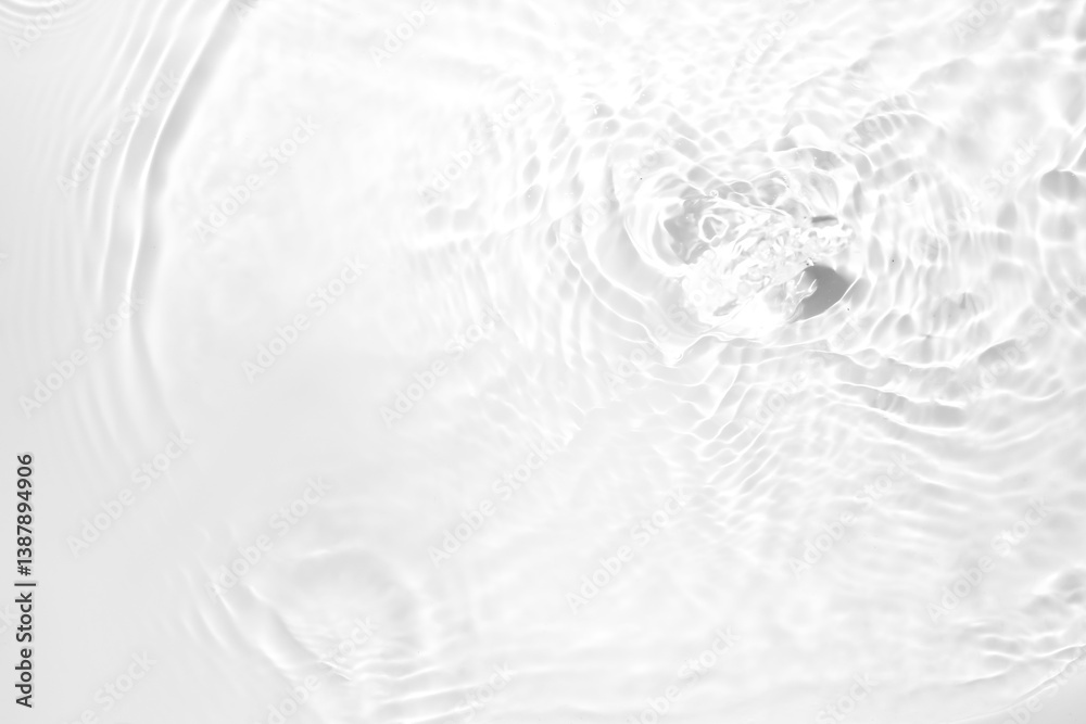 Ripple Effect in Clear Water Surface with Soft White Background Ripple Effect in Clear Water Surface with Soft White Background