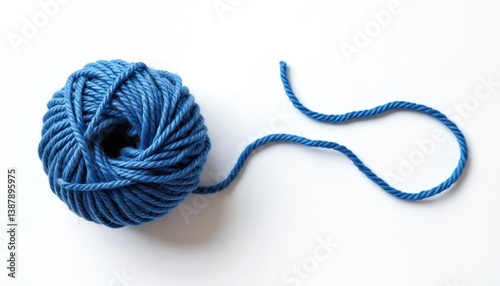 Soft blue woolen yarn ball isolated white background. Top view of yarn skein for handcraft, hobby, leisure. Thread texture clew for handmade clothing, sewing, craftwork.