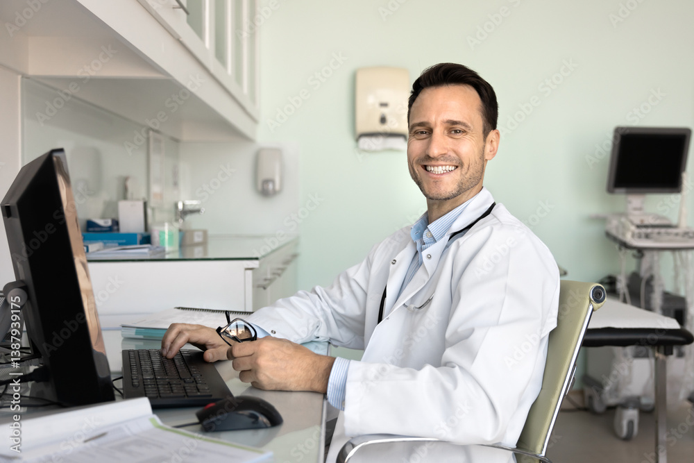 Portrait of smiling professional gp sit at desk with pc, look at camera, distracted from upcoming patient consultation preparation, medical reports writing. Technology in modern healthcare, workflow Portrait of smiling professional gp sit at desk with pc, look at camera, distracted from upcoming patient consultation preparation, medical reports writing. Technology in modern healthcare, workflow