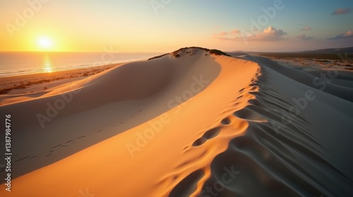 Fototapeta Naklejka Na Ścianę i Meble -  Aerial shot of Dune du Pilat in France at dawn, with sunny weather and the dunes bathed in soft, golden light.