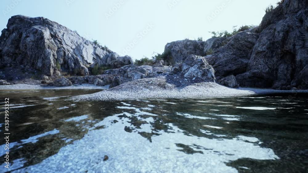 The water in Spains rocky cliff area is perfectly clear, revealing the stunning rocks in the background. The water in Spains rocky cliff area is perfectly clear, revealing the stunning rocks in the background.