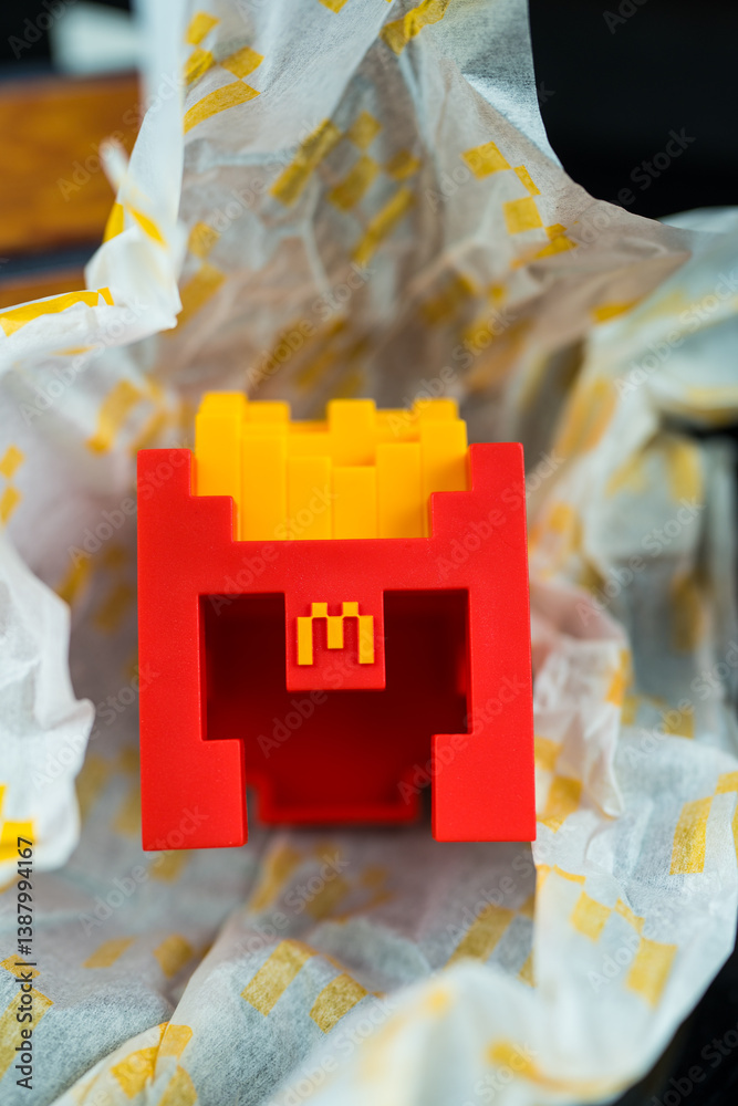 Fototapeta premium Bangkok, Thailand - April 6, 2025 : Fry Helmet Minecraft from McDonald, Toy form Minecraft blind box from McDonald's collaborates Minecraft the movice