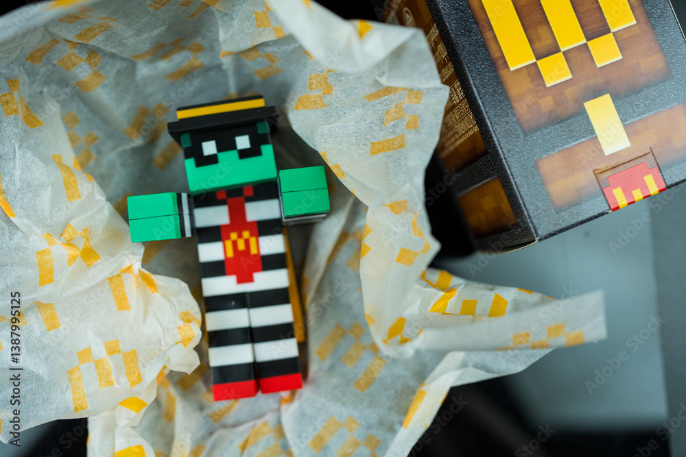 Naklejka premium Bangkok, Thailand - April 6, 2025 : Toy of Zombie hamburglar form McDonald. Blind box toy from McDonald's collaboration with Minecraft movie.