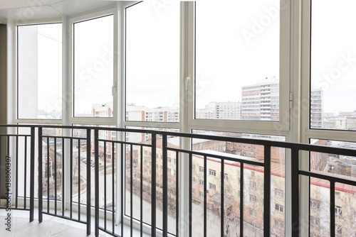 the balcony of an apartment on the upper floors of an apartment building