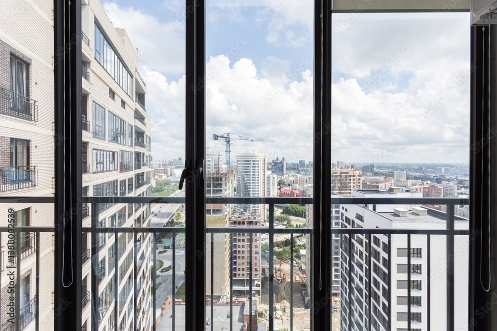 Fototapeta premium the balcony of an apartment on the upper floors of an apartment building