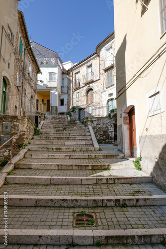 Obraz na płótnie A narrow street among the old houses of Ripamolisani, a medieval village in Molise, Italy. w salonie
