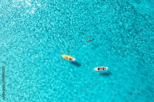 Aerial view of kayaks in bl...