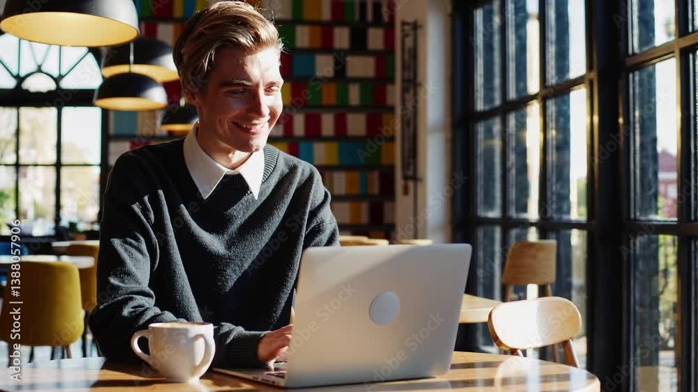 Freelancer  typing on a laptop keyboard in caffee.