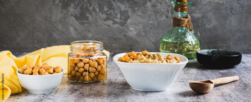Homemade hummus with chickpeas in a bowl on the table web banner