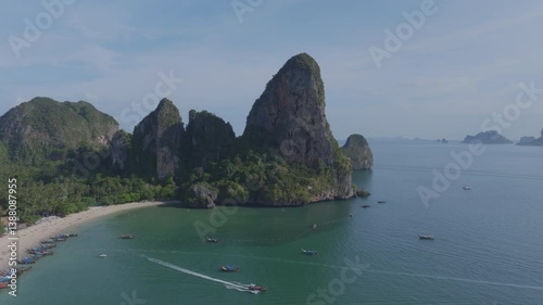 drone shot of a beach with crystal clear blue water and limestone cliffs in Krabi, Thailand. Railay Beach.