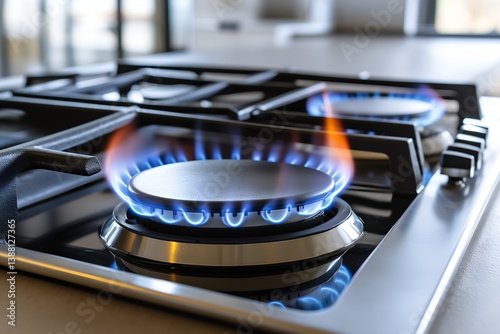Modern gas stove with blue flames in contemporary kitchen setting