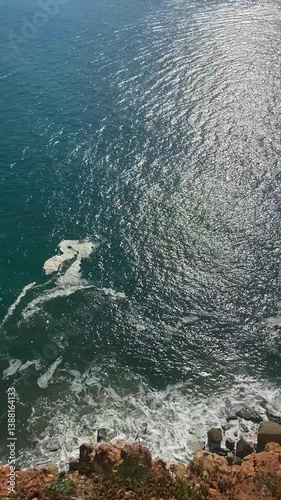 Beach on the ocean from above. Big waves on the ocean beach. Panorama of the ocean coast. General plan of the ocean coast from above.