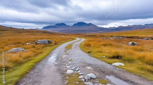 Mountain trail winds through autumnal landscape