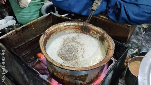 Traditional Cooking of Food in a Pot Over Fire