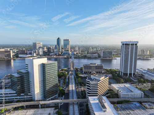 Cityscape view from San Marco and downtown Jacksonville, Florida, on a beautiful blue-sky spring day, with the river, John T. Alsop Jr. Bridge, and tall buildings.