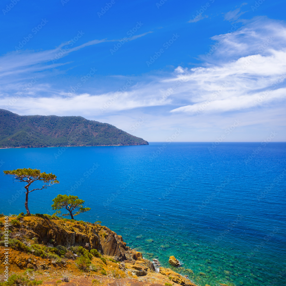 emerald sea bay with mountain near a coast emerald sea bay with mountain near a coast