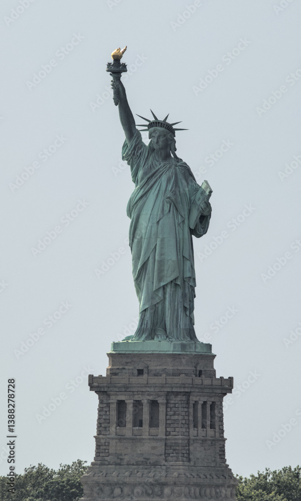 Fototapeta premium statue of liberty close up (lady with torch crown toga book) symbol of freedom democracy usa united states of america iconic nyc landmark