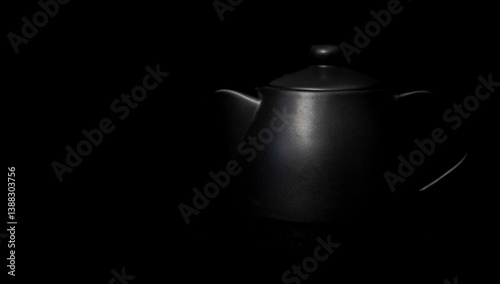 black ceramic teapot