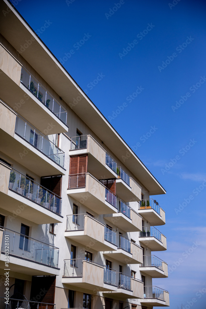 A Contemporary Modern Apartment Building Stretching Upward Under a Clear Blue Sky Above