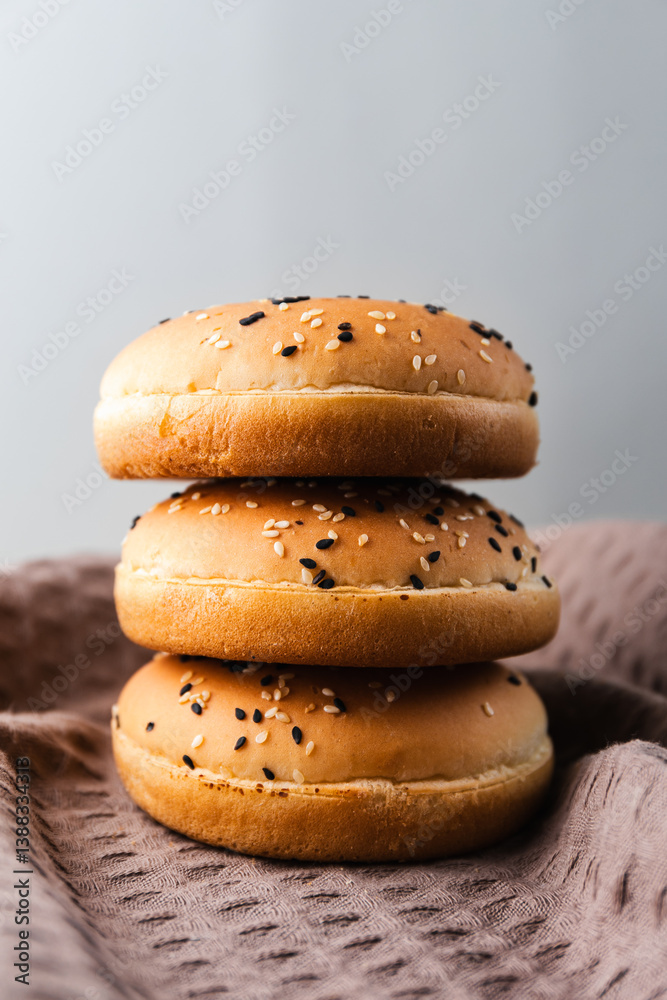 Wheat burger buns on the kitchen table Wheat burger buns on the kitchen table