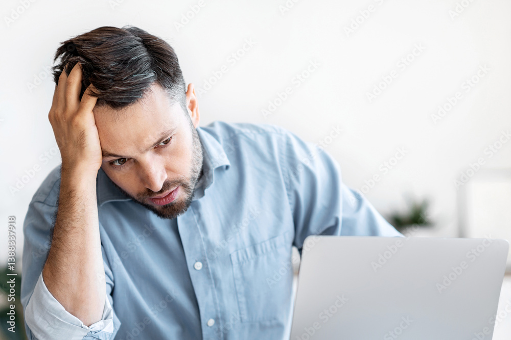 Deadline Stress. Depressed Office Employee Suffering From Problems At Work, Sitting At Desk In Office, Looking At Laptop Screen Deadline Stress. Depressed Office Employee Suffering From Problems At Work, Sitting At Desk In Office, Looking At Laptop Screen