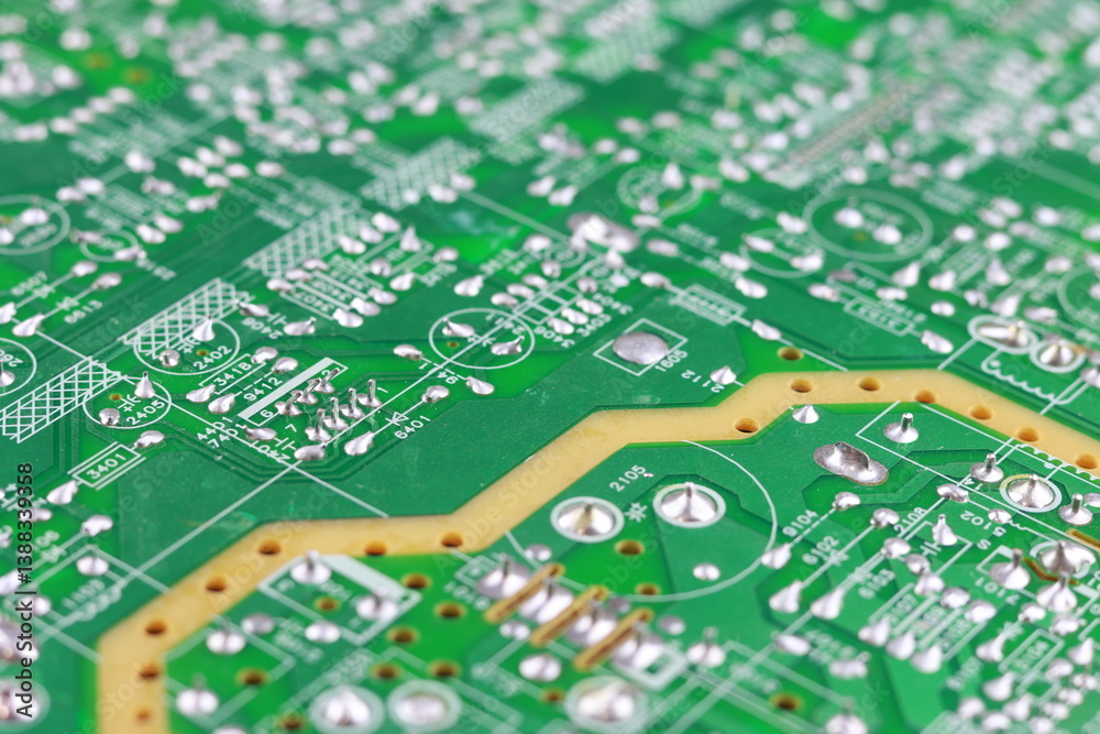 Green circuit board close-up with electronic components and connectors Green circuit board close-up with electronic components and connectors