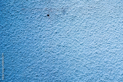 Light Blue Plaster Wall Texture – Rough Surface Background photo