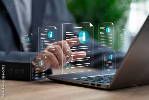 HRM Concept, Human Resource Management, Businessman selects the best candidate human from online job applications, Select personnel based qualifications, finds expert specialists to join for work