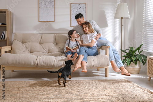 Wallpaper Mural Happy family on sofa and puppy in living room Torontodigital.ca