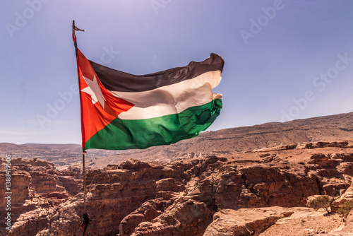 Flag of Jordan above the ancient city Petra, Jordan