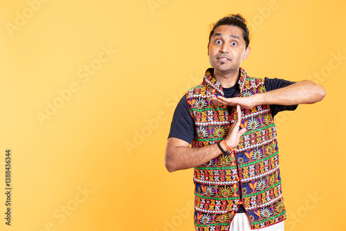 Portrait of assertive man asking for timeout, doing hand gestures, feeling fatigued. Firm person doing vehement pause sign gesturing, wishing for break, studio background