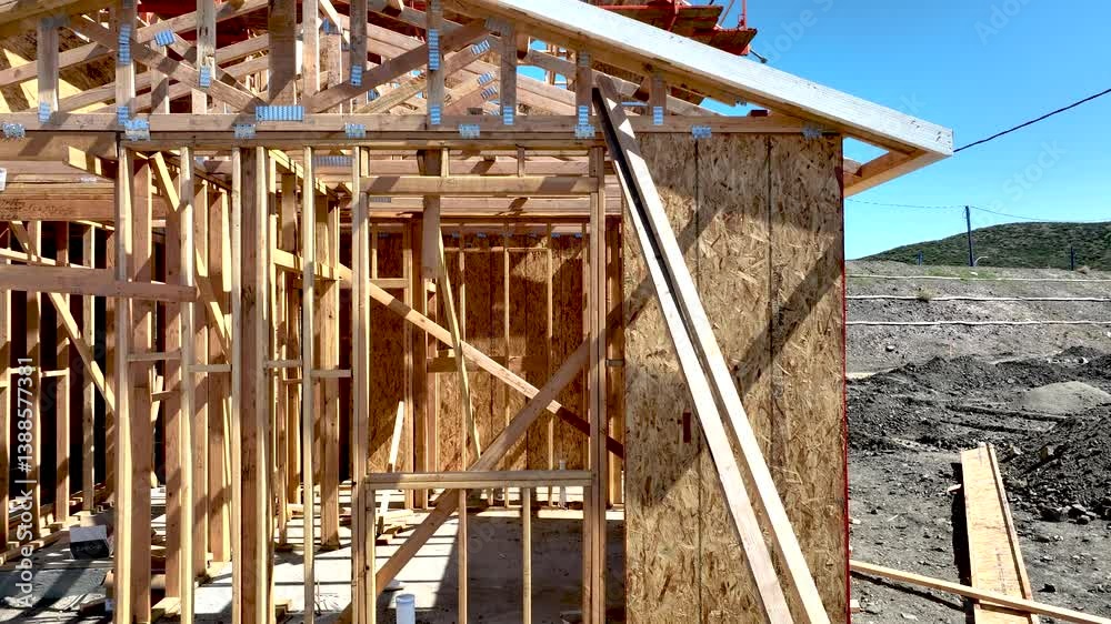 Dramatic Slow Motion Panning Movement of New Home Wood Framing Construction Site. Dramatic Slow Motion Panning Movement of New Home Wood Framing Construction Site.