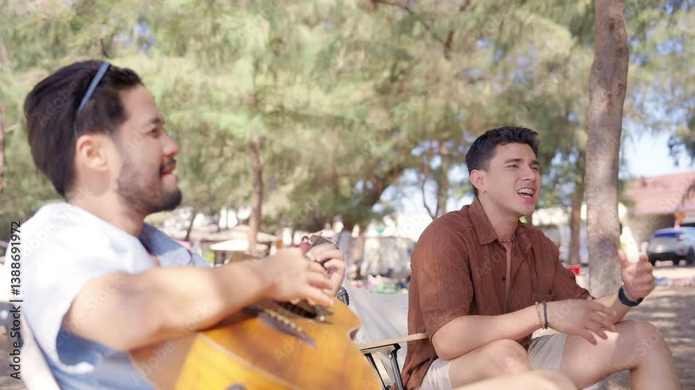 Happy man and woman travel nature the sea on summer beach holiday vacation. Group of Asian people friends enjoy and fun outdoor lifestyle relaxing and picnic together on tropical beach in sunny day.