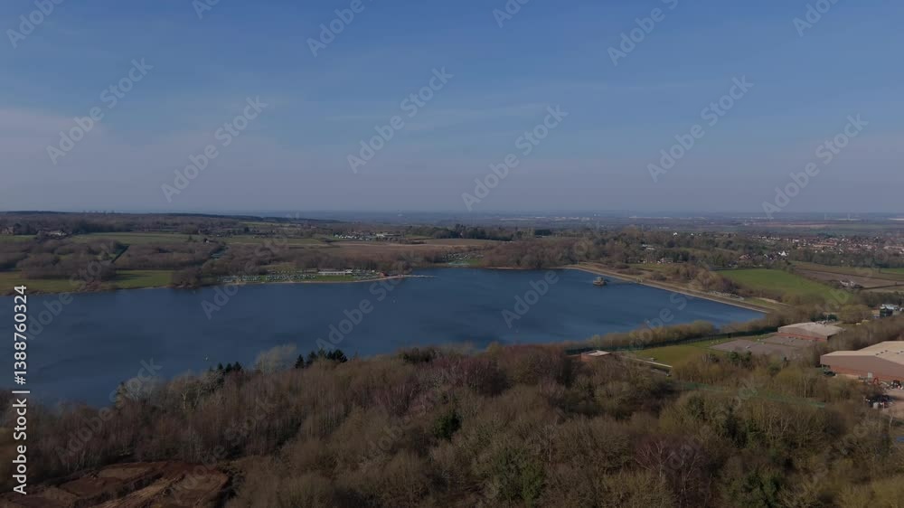 Stunning aerial view of a large reservoir surrounded by forests and quiet countryside, UK. Stunning aerial view of a large reservoir surrounded by forests and quiet countryside, UK.