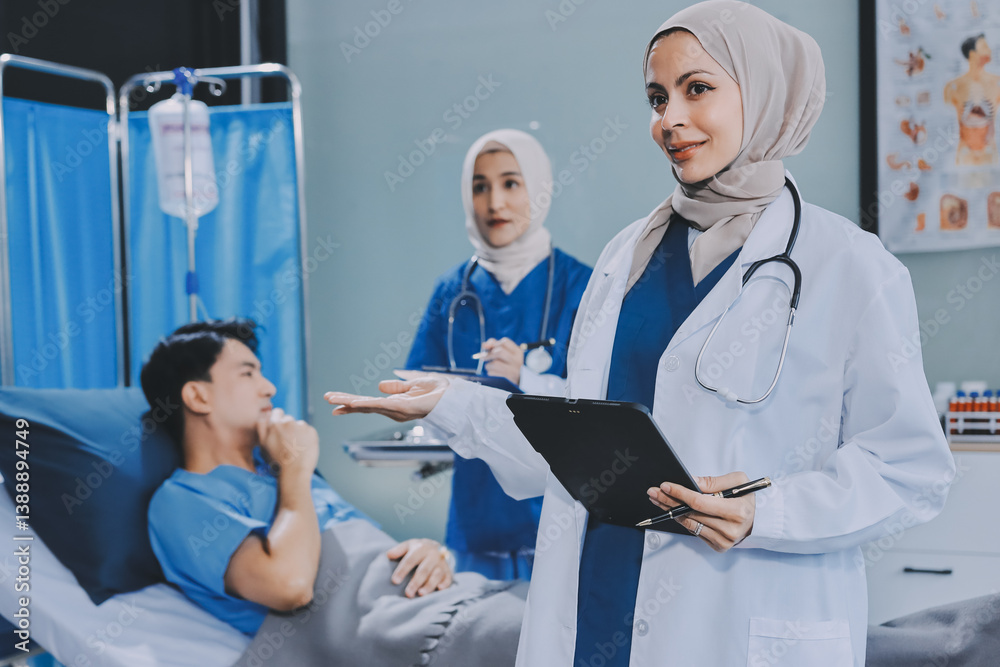 Obraz premium A young man lies on a bed in a hospital ward talking with her young Indian doctor. Doctor checking patient's health doctor treating patient, hospital admission of patient