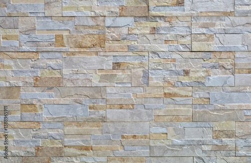 Stoneware paneling wall with stone effect. Colors are gray and shades of brown. External  decor covering. Background and texture.