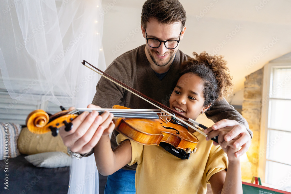 Private music man teacher giving violin lessons to African American girl at home Private music man teacher giving violin lessons to African American girl at home