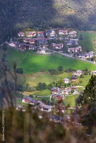 Alpe di Siusi, Italy aerial panoramic view with wooden cottages at Seiser Alm, Dolomite plateau in South Tyrol province in autumn