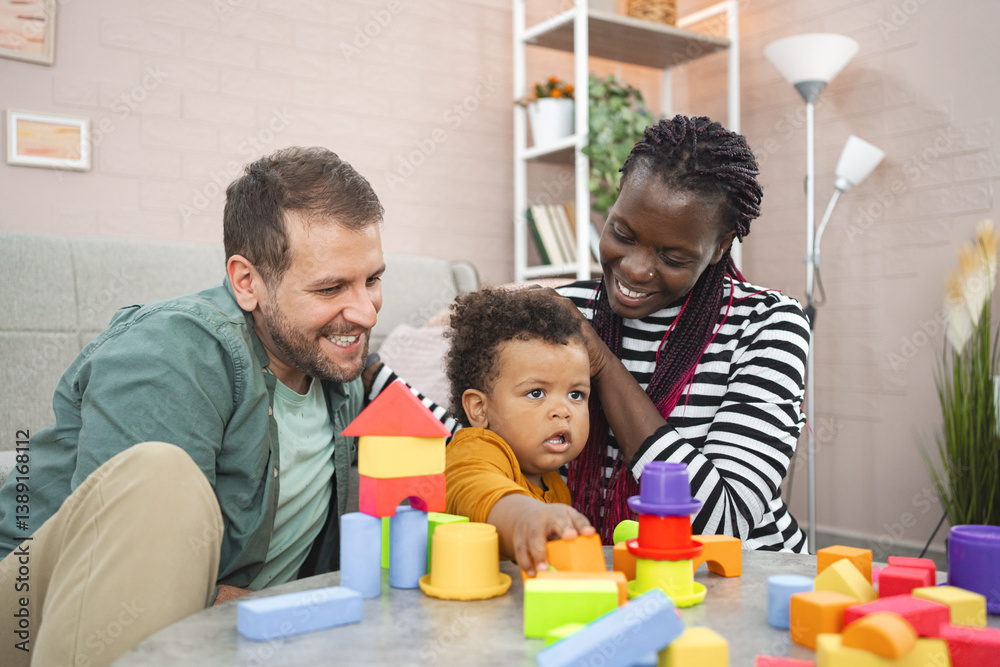 Multiracial family playing with colorful building blocks at home Multiracial family playing with colorful building blocks at home