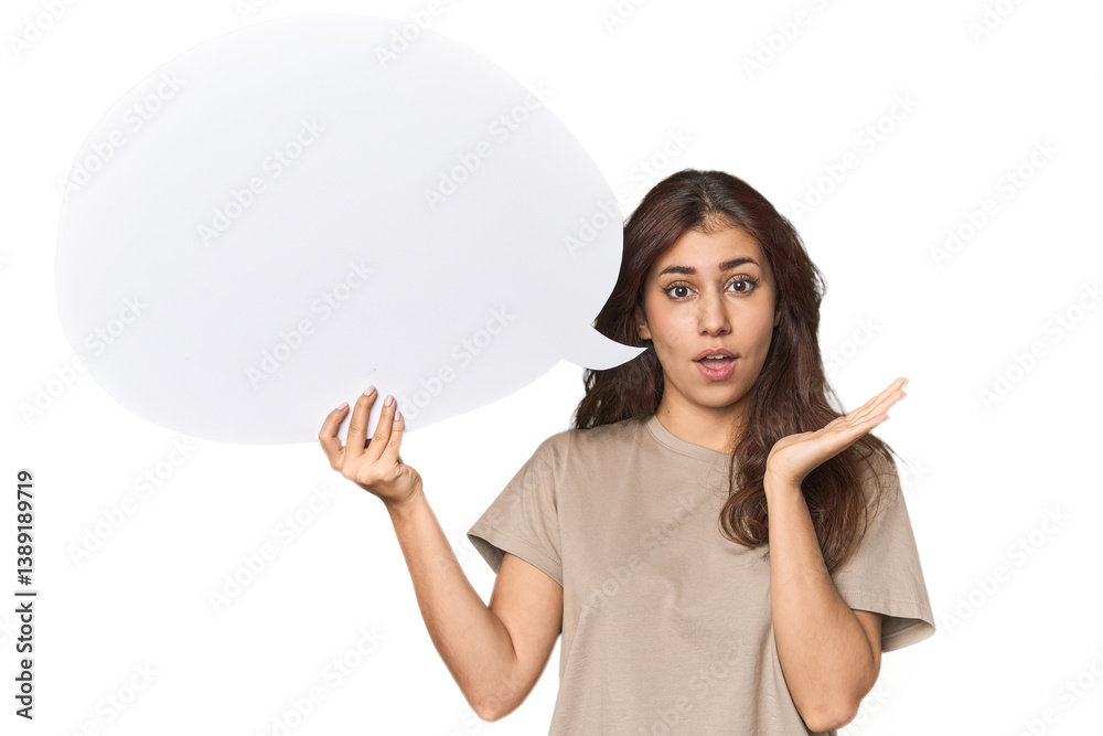 Middle Eastern woman holding comic bubble surprised and shocked. Middle Eastern woman holding comic bubble surprised and shocked.