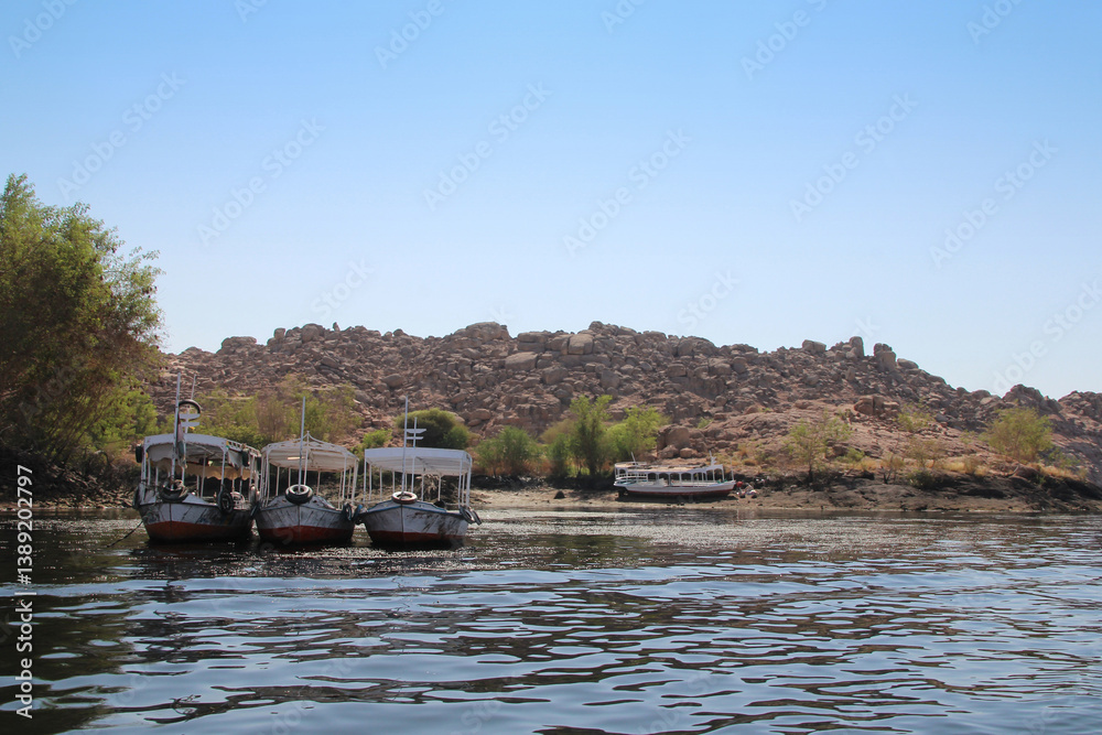 Fototapeta premium Motorboat to travel across the River Nile to Philae Temple, Aswan, Egypt