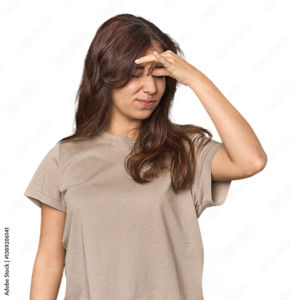 Middle Eastern woman in studio having a head ache, touching front of the face. Middle Eastern woman in studio having a head ache, touching front of the face.