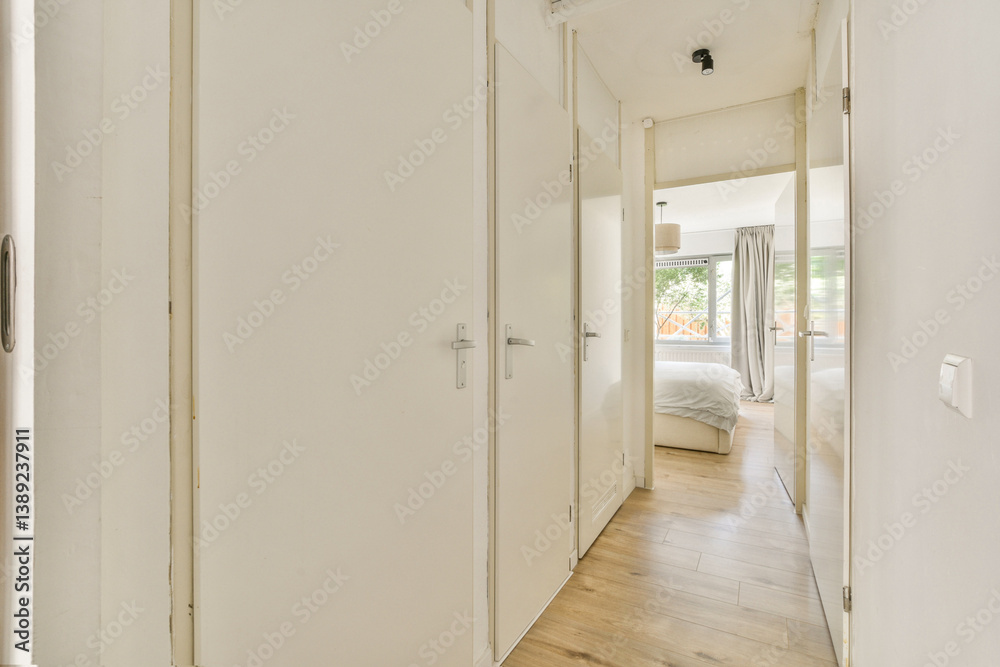 A contemporary hallway featuring white walls, wooden flooring, and natural light streaming through an open doorway, enhancing its welcoming atmosphere. A contemporary hallway featuring white walls, wooden flooring, and natural light streaming through an open doorway, enhancing its welcoming atmosphere.