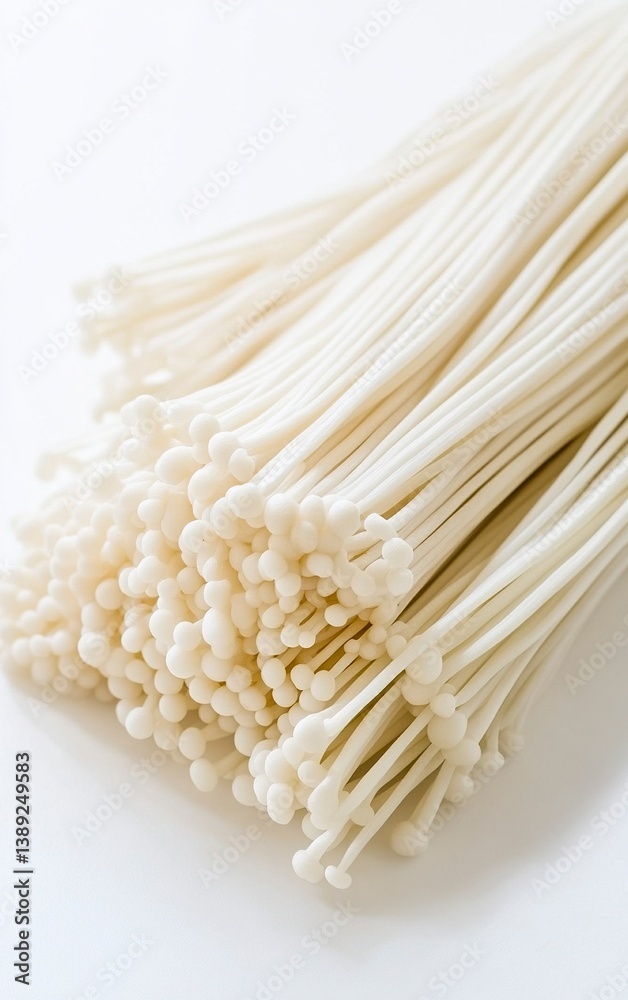White enoki mushrooms on a white background, close-up, side view, with copy space, stock photo, HDRI White enoki mushrooms on a white background, close-up, side view, with copy space, stock photo, HDRI