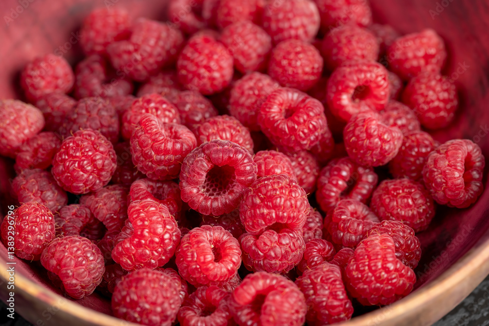 raspberries on the table, the collected amount of ripe raspberries is red closeup raspberries on the table, the collected amount of ripe raspberries is red closeup