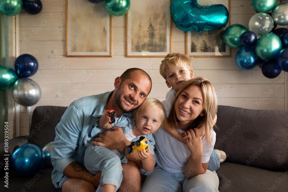 Family celebrates a special occasion at home with balloons and joyful expressions during a cozy afternoon
