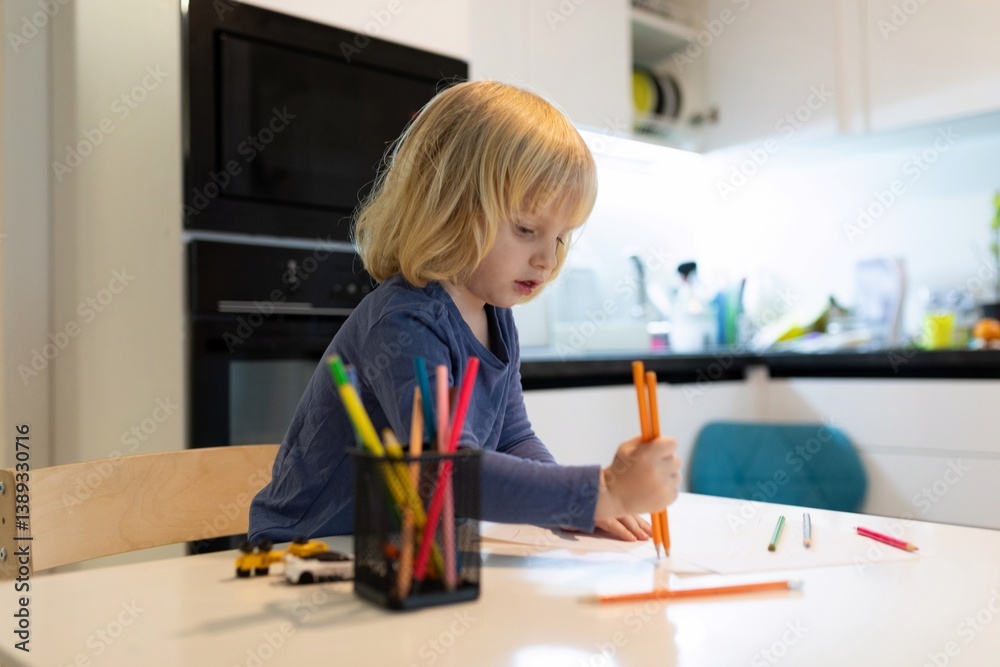 Child engaged in creative drawing activity at home during the daytime