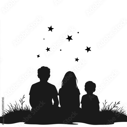 Family silhouette gazing at stars in a grassy field  